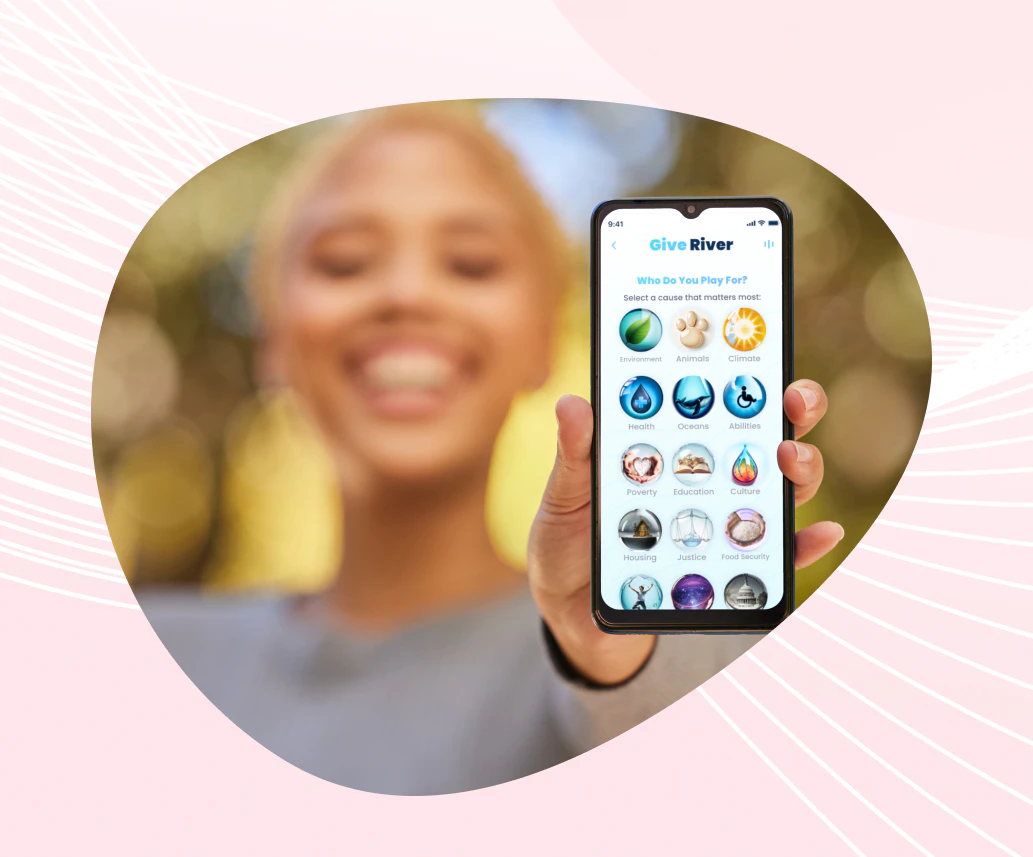 A woman holding up a smart phone with icons on it