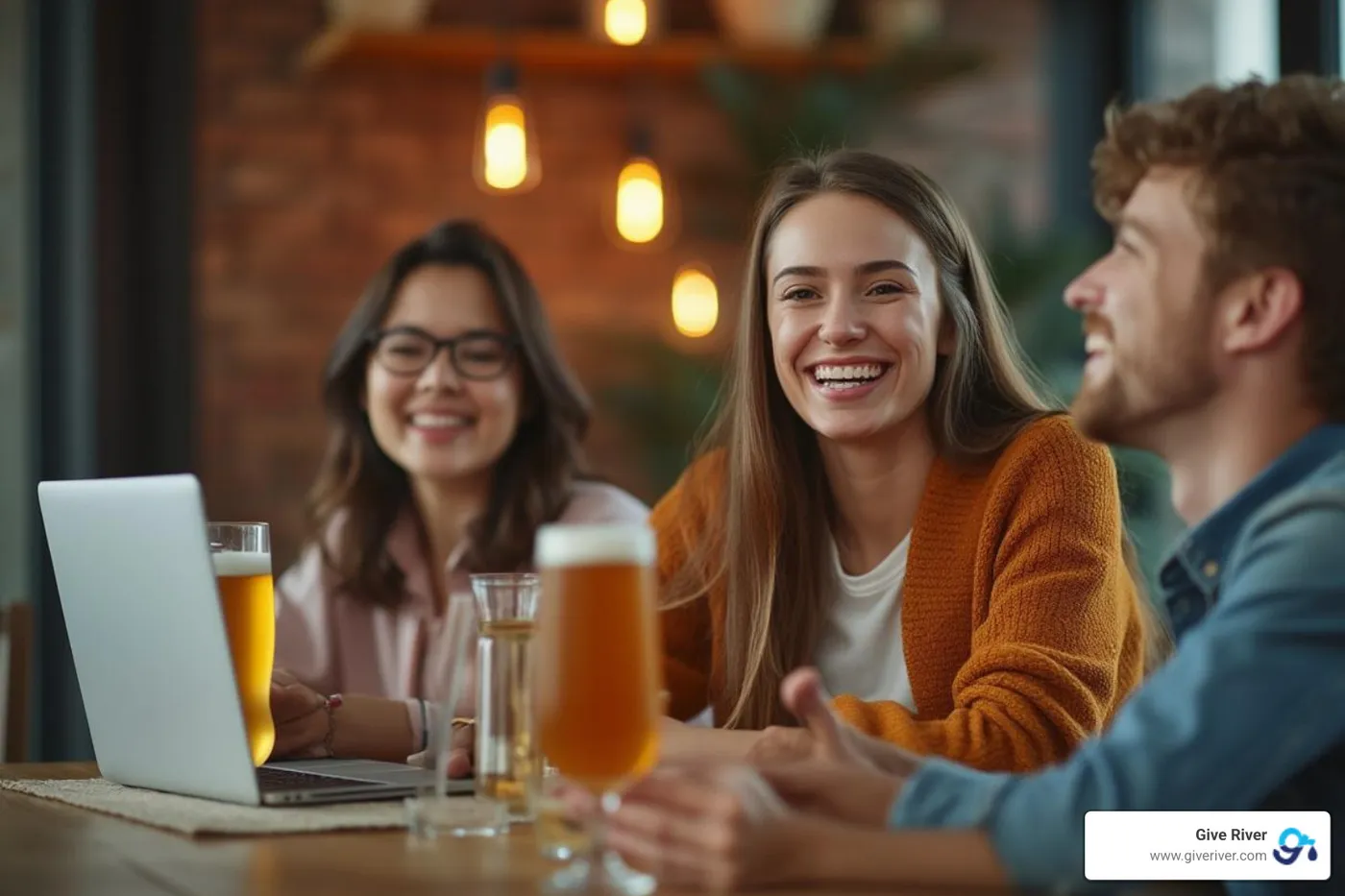 A remote employee smiling during a virtual team event with a happy hour kit in front of them - employee engagement gifts