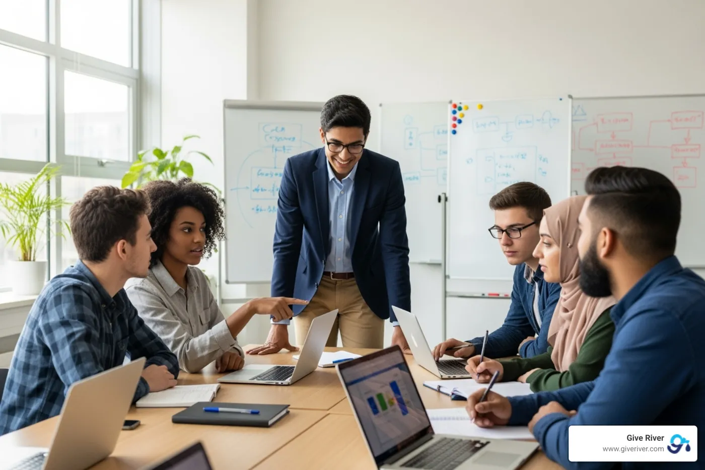 employees mentoring students in a classroom setting - new csr initiatives
