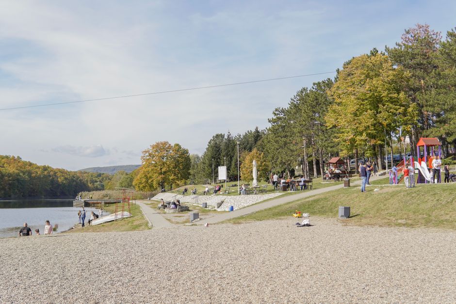a vibrant public park with benches, walking paths, and a playground - building a better community