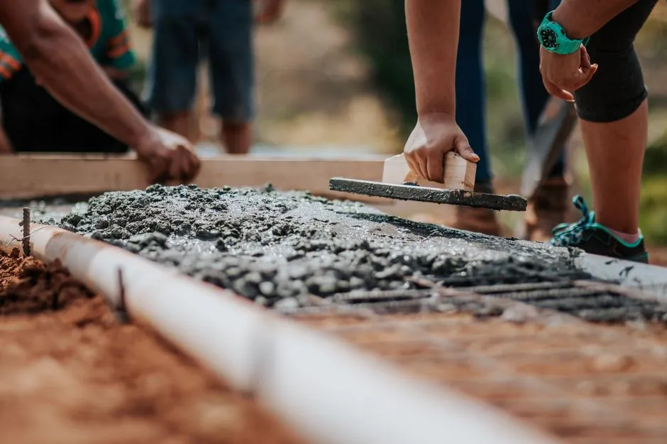 Team collaborating on a volunteer project, like building a playground - benefits of employee volunteering