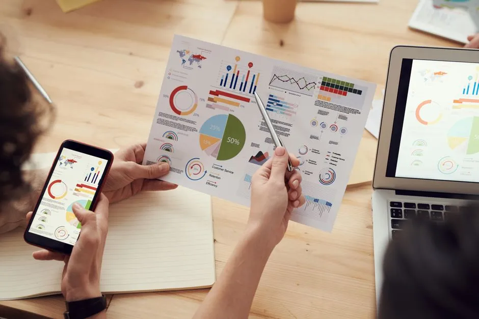 team analyzing data on a dashboard - learning and development tools
