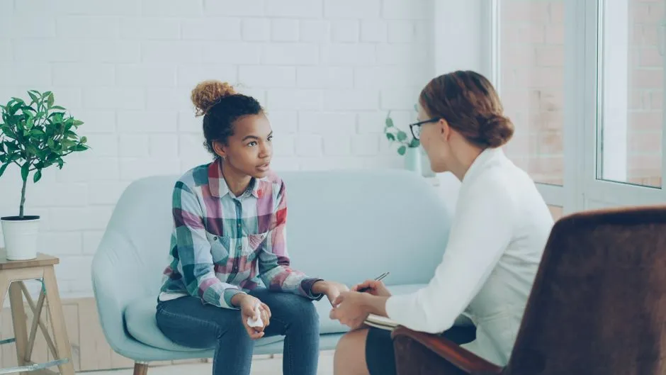 manager conducting a supportive one-on-one check-in - employee wellbeing strategies