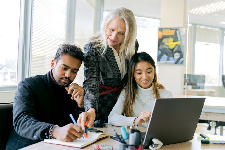 Team collaborating on career development planning - career development programs examples