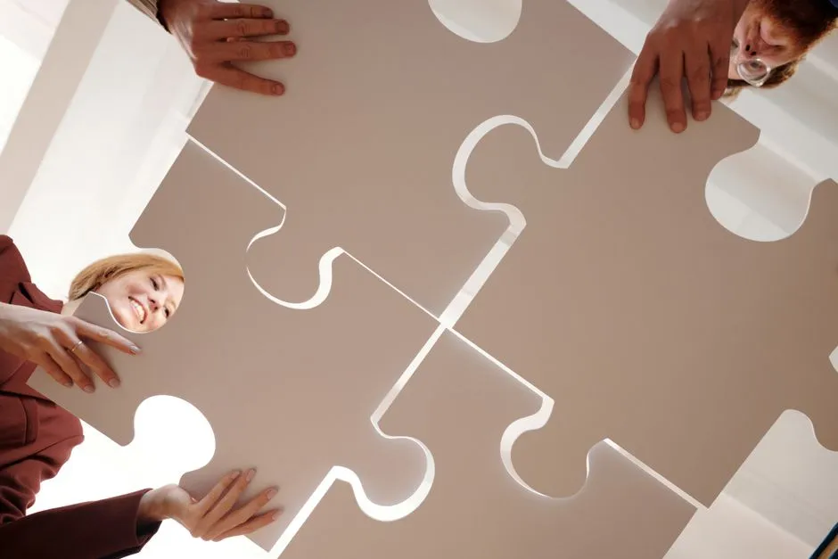 image of a team working on a puzzle during a relay - relay race ideas for team building