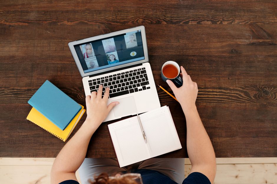 Two teammates enjoying a virtual coffee chat - remote work culture activities