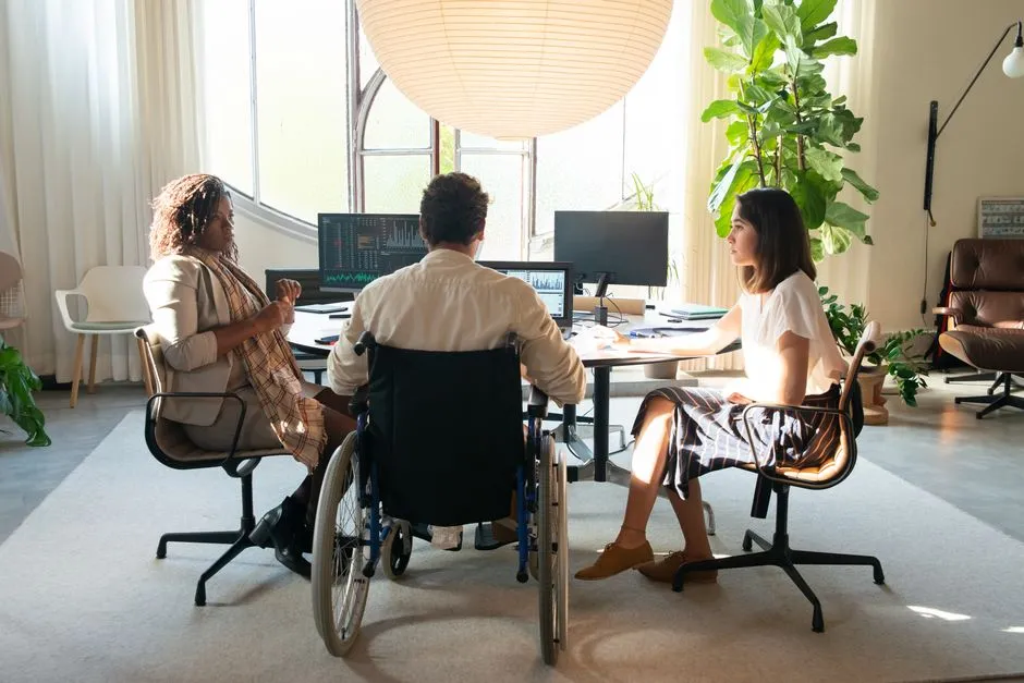 a diverse and inclusive team collaborating in an office setting - csr initiatives examples