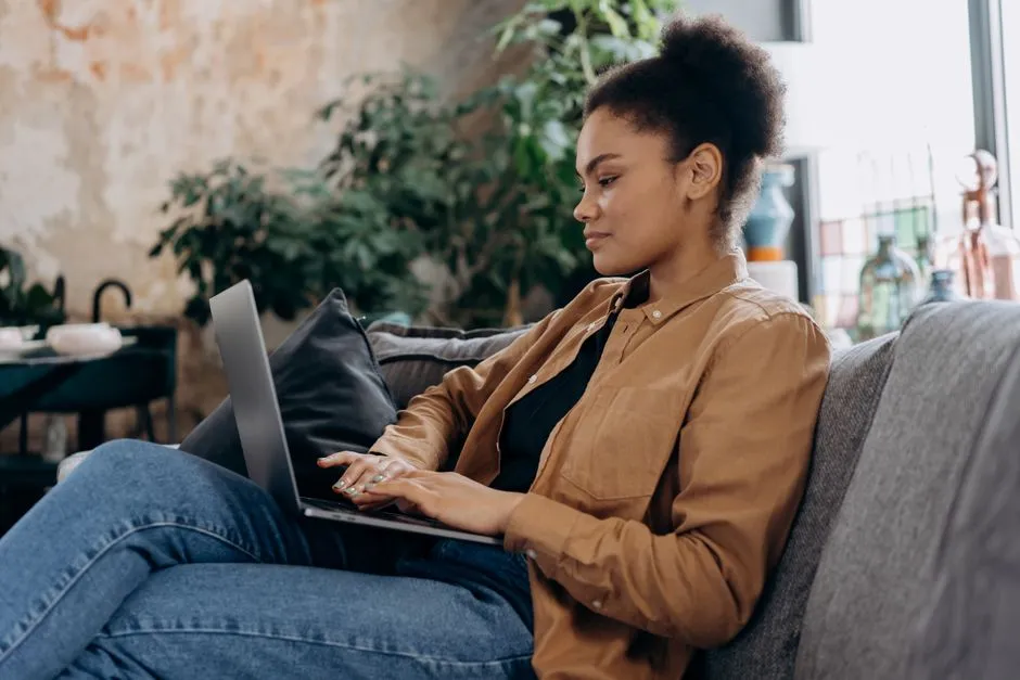 Person using laptop to submit a matching gift request - company matching gift programs