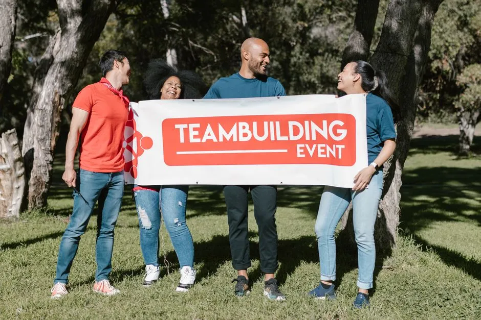 Employees participating in a fun team-building activity as a reward, smiling and collaborating - rewards and recognition