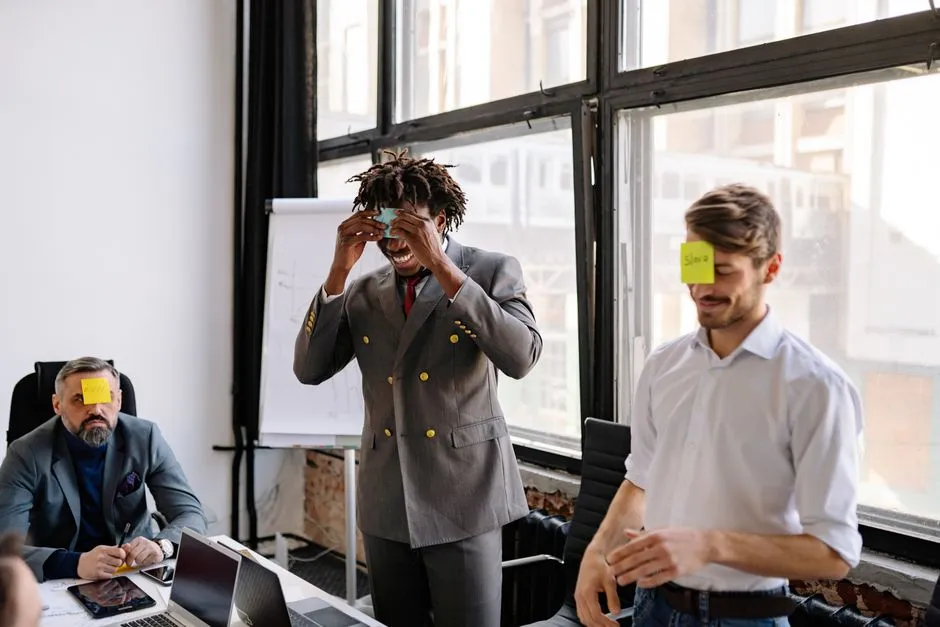 employees participating in an office scavenger hunt and laughing