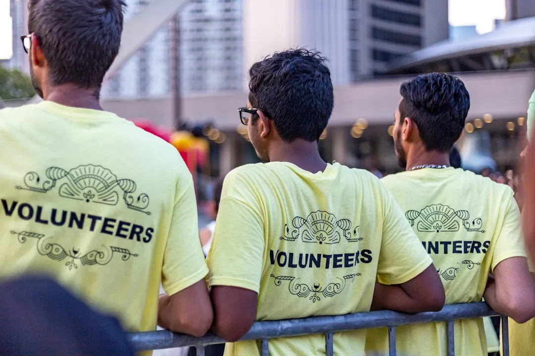 employees volunteering at community project - charitable giving at work