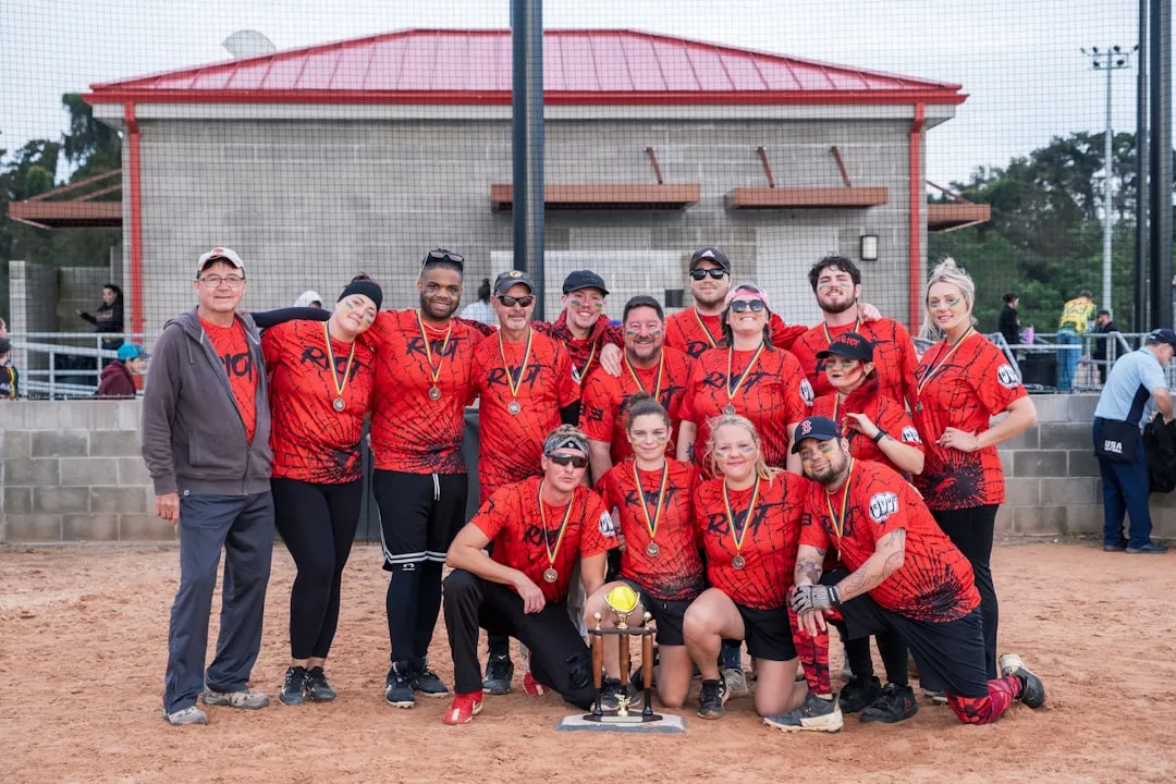 A happy team holding trophies and smiling together