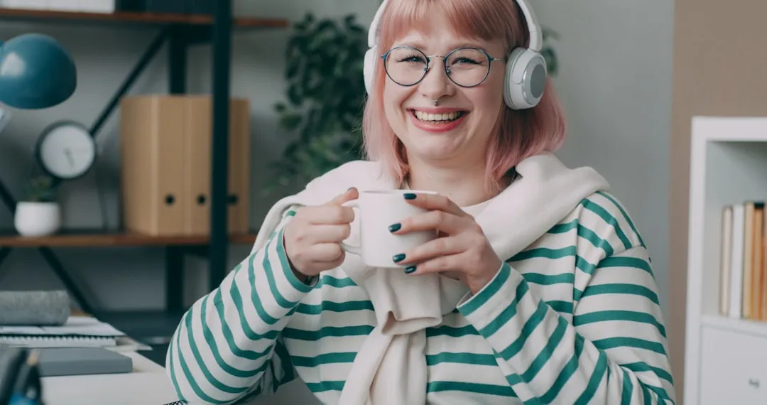 person on a video call smiling warmly - team building questions for remote workers