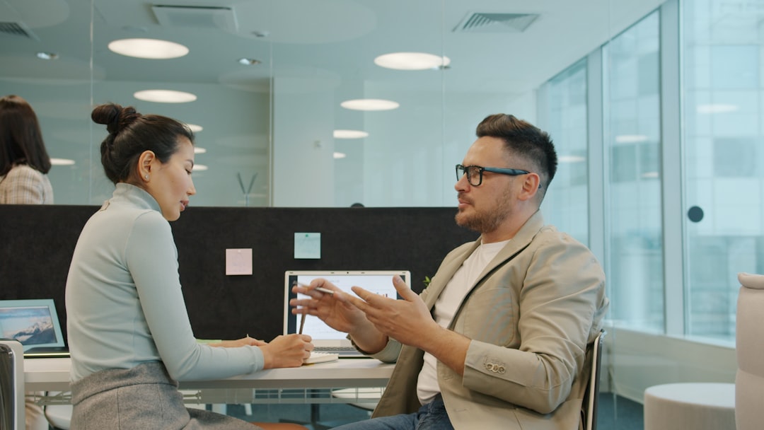 employee and manager discussing feedback - hr employee survey