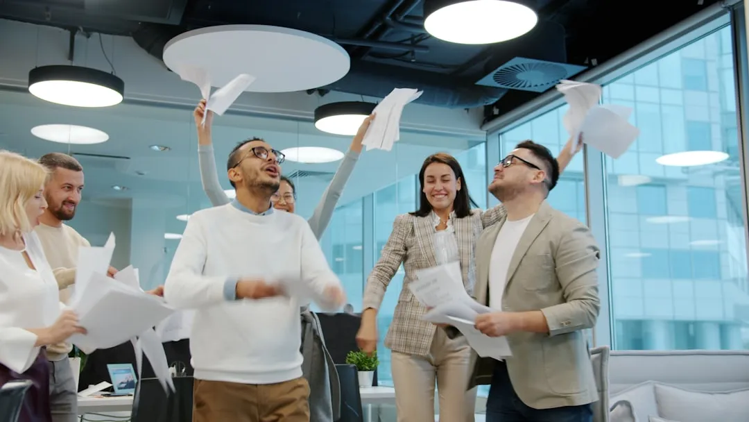 employees celebrating a team achievement - employee reward and recognition