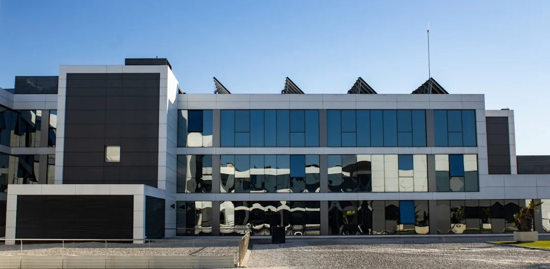 modern corporate office with solar panels and green spaces - Corporate citizenship examples